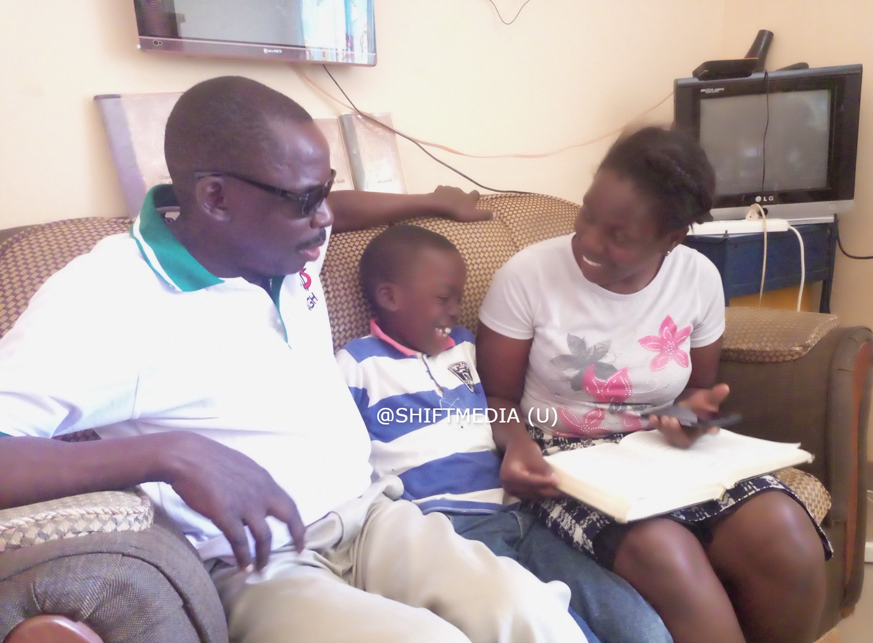 Pastor Opio Obale with his son Jersey, and wife he intends to wed on June 17 2013 at Kyanja Church PHOTO/JARAMOGI PATRICK